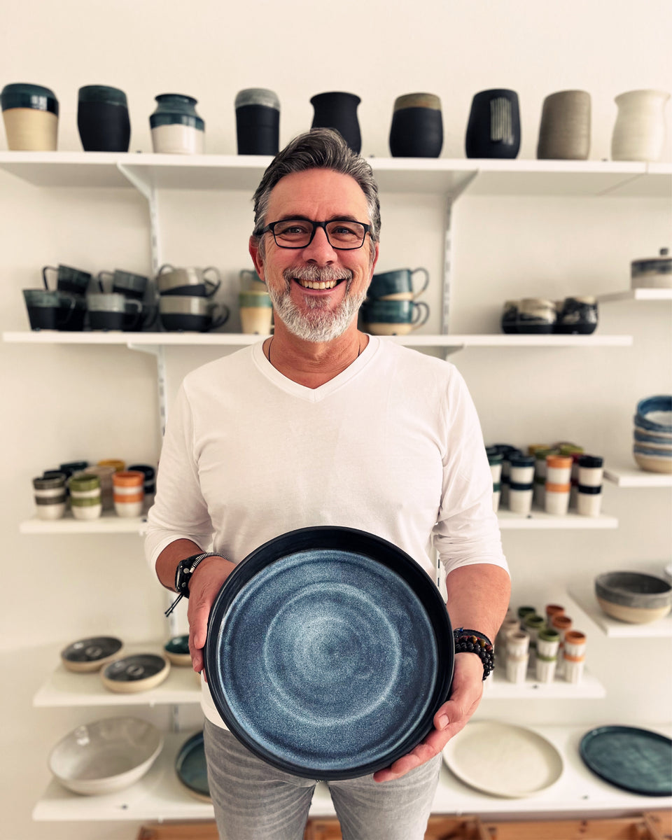 Owner Niko in his studio handmade ceramics